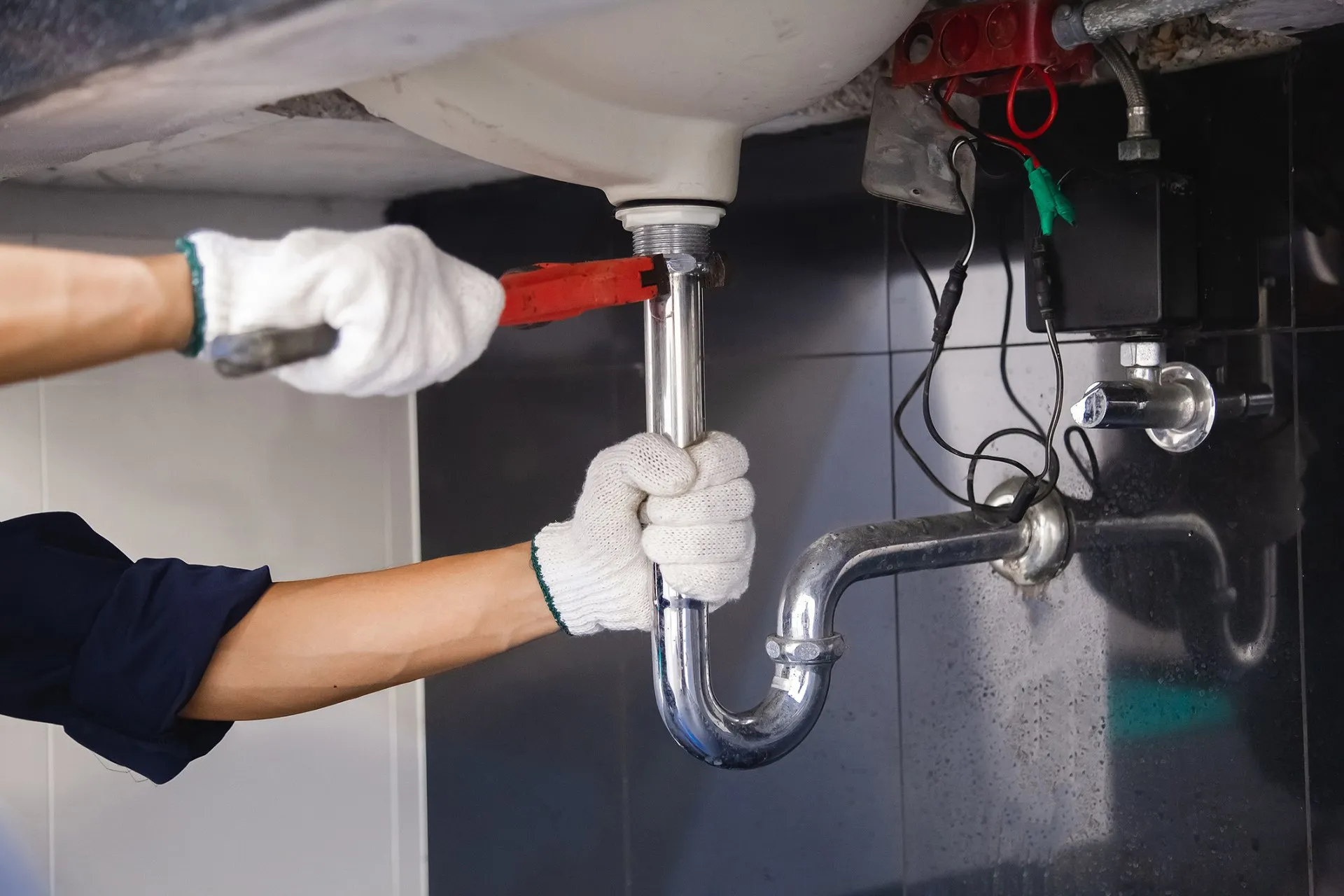 GettyImages-1335553245-1920w fixing a pipe